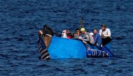 A drifting boat with Cuban citizens trying to leave the country is seen on the coast of Havana on December 12, 2022. (Photo by YAMIL LAGE / AFP)