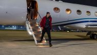 US basketball star Brittney Griner steps off a plane following her release from prison in Russia, in an unknown location, in this picture obtained from social media released on December 16, 2022. (US Army South/Miguel A. Negron via REUTERS) 
