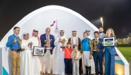 H E Salah bin Ghanem Al Ali, Minister of Sports and Youth, with the connection of Sealine after Wathnan Racing's eight-year-old horse won the Late Sheikh Jassim Bin Mohammed Al Thani Trophy at Al Uqda Racecourse yesterday.
