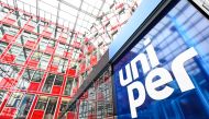 This file photo taken on July 22, 2022 shows the logo of energy supplier Uniper in the entrance hall at the company's headquarters in Duesseldorf, western Germany. (Photo by Ina Fassbender / AFP)