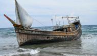 This picture shows a boat that was carrying Rohingya refugees after their arrival at a beach in Krueng Raya, Indonesia's Aceh province on December 25, 2022. Photo by CHAIDEER MAHYUDDIN / AFP