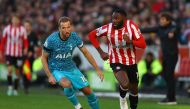 Tottenham Hotspur's Harry Kane in action with Brentford's Josh Dasilva during a Premier League match at Brentford Community Stadium, London, Britain, December 26, 2022. (Reuters/Matthew Childs)