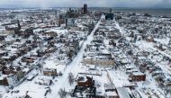 Snow blankets the city in this aerial drone photograph in Buffalo, New York, on December 25, 2022. (Photo by Joed Viera / AFP)