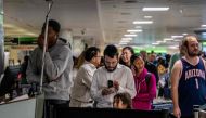 Travelers wait in line for assistance with lost luggage at the William P. Hobby Airport on December 28, 2022 in Houston, Texas. Brandon Bell/Getty Images/AFP