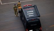 Military police members work following a suspected bomb threat in the city's hotel section, close to where President-elect Luiz Inacio Lula da Silva is staying before his Jan 1 inauguration, in Brasilia, Brazil, December 27, 2022. Reuters/Adriano Machado