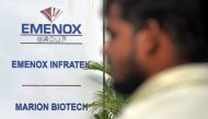 A man walks past the office entrance of Marion Biotech, a pharmaceutical company in Noida on the outskirts of New Delhi on December 29, 2022. (AFP)