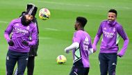 Real Madrid's French forward Karim Benzema (left), Real Madrid's French defender Aurelien Tchouameni (centre) and Real Madrid's Brazilian defender Eder Militao attend a training session at the Ciudad Real Madrid training complex in Valdebebas, outskirts of Madrid, on December 29, 2022, on the eve of their Spanish League football match against Real Valladolid FC. (Photo by JAVIER SORIANO / AFP)