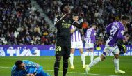 Real Madrid's Brazilian forward Vinicius Junior (centre) reacts as Real Valladolid's Spanish goalkeeper Jordi Masip holds the ball during the Spanish League football match between Real Valladolid FC and Real Madrid CF at the Jose Zorilla stadium in Valladolid on December 30, 2022. (Photo by CESAR MANSO / AFP)