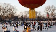 People enjoy an ice rink on a frozen lake, amid the coronavirus disease (COVID-19) outbreak in Beijing, China December 31, 2022. REUTERS/Florence Lo