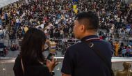 Passengers wait for information about their flights at terminal 3 of Ninoy International Airport in Pasay, Metro Manila on January 1, 2023. (Photo by KEVIN TRISTAN ESPIRITU / AFP)
