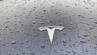 A view shows the Tesla logo on the hood of a car in Oslo, Norway November 10, 2022. REUTERS/Victoria Klesty/File Photo