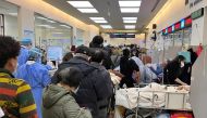 Patients lie on beds next to closed counters at the emergency department of Zhongshan Hospital, amid the coronavirus disease (COVID-19) outbreak in Shanghai, China January 3, 2023. REUTERS/Staff