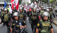 Police officers walk during a march asking for peace, after violent protests in the country, following the ousting and arrest of former President Pedro Castillo, in Lima, Peru January 3, 2023. (REUTERS/Sebastian Castaneda)