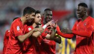 Bassam Al Rawi celebrates with teammates after scoring Al Duhail's second goal yesterday. 