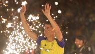 Al-Nassr's new Portuguese forward Cristiano Ronaldo greets the fans during his unveiling at the Mrsool Park Stadium in the Saudi capital Riyadh on January 3, 2023. (Photo by Fayez Nureldine / AFP)
 