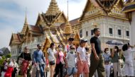 Tourists visit the Grand Palace, one of the top tourist attraction spots as Thailand is expecting arrivals of Chinese tourists after China reopens its borders amid the coronavirus (COVID-19) pandemic, in Bangkok, Thailand, January 7, 2023. REUTERS/Athit Perawongmetha