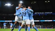 Manchester City's Argentinian striker Julian Alvarez (centre) celebrates with teammates after scoring their second goal from the penalty spot during the English FA Cup third round football match between Manchester City and Chelsea at the Etihad Stadium in Manchester, north-west England, on January 8, 2023. (Photo by Oli SCARFF / AFP)