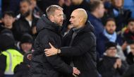 Chelsea's English head coach Graham Potter (left) and Manchester City's Spanish manager Pep Guardiola shake hands after the English FA Cup third round football match between Manchester City and Chelsea at the Etihad Stadium in Manchester, north-west England, on January 8, 2023. - Man City won the game 4-0 (Photo by Oli SCARFF / AFP)