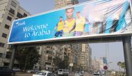 Vehicles pass under a billboard displaying Cristiano Ronaldo wearing a shirt of the Saudi Arabian club Al-Nassr,  in Cairo, Egypt, January 9, 2023. (REUTERS/Amr Abdallah Dalsh)