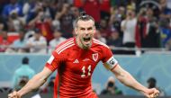 In this file photo taken on November 21, 2022 Wales' forward Gareth Bale celebrates scoring his team's first goal during the Qatar 2022 World Cup Group B football match between USA and Wales at the Ahmad Bin Ali Stadium in Al-Rayyan, west of Doha. (Photo by NICOLAS TUCAT / AFP)