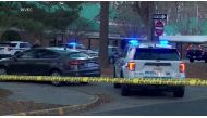Police vehicles are seen parked outside Richneck Elementary School, where according to the police, a six-year-old boy shot and wounded a teacher, in Newport News, Virginia, U.S., January 6, 2023, in this screen grab from a handout video. WVEC via ABC/Handout via REUTERS
