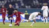 Qatar's Ali Assadalla in action with Bahrain's Mohamed Marhoon during their Arabian Gulf Cup25 Group B match at the  Al-Minaa Olympic Stadium, Basra, Iraq on January 10, 2023.  REUTERS/Thaier Al-Sudani
 