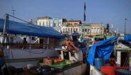 In this file photo taken on September 17, 2021, a fisherman is seen on a fish boat docked at the Ver-o-Peso popular market in Belem, Para state, Brazil. (AFP)