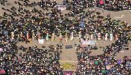 Aerial view of relatives and friends of the victims of clashes with the Peruvian police puting their coffins in the main plaza of the Andean city of Juliaca, southern Peru, on January 11, 2023. (Photo by Juan Carlos Cisneros / AFP)