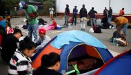 Migrants rest outside the Siglo XXI migrant detention center as they seek humanitarian visas to cross the country and reach the US, in Tapachula, Chiapas state, Mexico, on January 11, 2023. REUTERS/Jacob Garcia