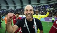 Coach Bruno Pinheiro celebrates after Qatar qualified for the semi-finals.