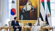 This handout image provided by the UAE Presidential court shows Emirati President Sheikh Mohamed bin Zayed Al-Nahyan (R) meeting with South Korea's President Yoon Suk-yeol during a state visit at the royal palace in Abu Dhabi, on January 15, 2023. (Photo by Rashed AL-MANSOORI / UAE PRESIDENTIAL COURT / AFP)