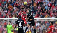 Almeria's Malian forward El Bilal Toure (top-left) and Atletico Madrid's Spanish defender Mario Hermoso jump for the ball during the Spanish League football match between UD Almeria and Club Atletico de Madrid at the Mediterranean Games Municipal Stadium in Almeria on January 15, 2023. (Photo by JORGE GUERRERO / AFP)