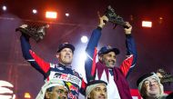 Toyota Gazoo Racing’s Qatari driver Nasser Saleh Al Attiyah celebrates with co-driver Mathieu Baumel of France, Qatar Motor and Motorcycle Federation President Abdulrahman bin Abdullatif Al Mannai and officials after winning his fifth Dakar Rally title in Saudi Arabia, on Sunday. PIC: RED BULL