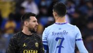Paris Saint-Germain's Argentine forward Lionel Messi walks past Riyadh All-Star's Portuguese forward Cristiano Ronaldo during the Riyadh Season Cup football match between the Riyadh All-Stars and Paris Saint-Germain at the King Fahd Stadium in Riyadh on January 19, 2023. (Photo by FRANCK FIFE / AFP)