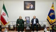 A handout picture provided by the Islamic Consultative Assembly News Agency (ICANA) on January 21, 2023, shows Iranian parliament speaker Mohammad Bagher Ghalibaf (right) meeting with the Islamic Revolutionary Guard Corps (IRGC) chief Hossein Salami, in the capital Tehran. (Photo by ICANA NEWS AGENCY / AFP)