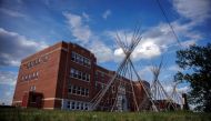 In this file photo taken on June 08, 2022, Teepee's stand outside the University nuhelt'ine tahiyots'i nistameyimakanak Blue Quills, the former residential school turned First Nation University, in St Paul, Alberta. (Photo by Cole Burston / AFP)