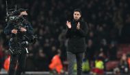 Arsenal's Spanish manager Mikel Arteta applauds fans on the pitch after the English Premier League match between Arsenal and Manchester United at the Emirates Stadium in London on January 22, 2023. - Arsenal won the game 3-2. (Photo by Glyn KIRK / AFP) 
