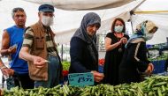 People shop at a open market in Istanbul, Turkey, June 10, 2022. REUTERS/Dilara Senkaya

