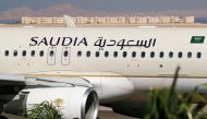 Saudia Airlines plane, is seen at the airport of the Red Sea resort of Sharm el-Sheikh, Egypt, August 9, 2021. Picture taken through a window. REUTERS/Mohamed Abd El Ghany.
