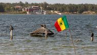 A general view of the submerged tourism businesses at the Pink Lake (Lac Rose), officially known as Lake Retba, after extreme floods washed away salt mounts and contaminated the lake and turned its famous waters from pink to green, in Niaga, near Dakar, Senegal, January 17, 2023. REUTERS/ Zohra Bensemra
