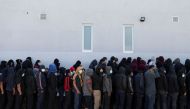 
Guatemalan deportees queue outside a government migration facility at the Guatemalan Air Force headquarters in La Aurora International airport, in Guatemala City, December 28, 2021. (REUTERS/Sandra Sebastian)