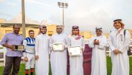 The connection of Wukair with Qatar Racing and Equestrian Club’s Racing Manager, Abdulla Rashid Al Kubaisi after Nasser Saeed Al Eida’s six-year-old bay horse won the Ras Rokn Island Cup during the ninth Al Uqda Meeting, yesterday. PICTURES: Juhaim/QREC