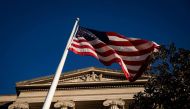 An American flag waves outside the US Department of Justice Building in Washington, US, on December 15, 2020. File Photo / Reuters