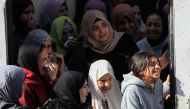 Palestinian women mourn at the funeral of one of the victims killed during an Israeli raid on the Jenin refugee camp in the occupied West Bank, yesterday. (AFP)