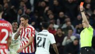 Spanish referee Cesar Soto Grado (right) gives a red card to Atletico Madrid's Montenegrin defender Stefan Savic (second left) during the Copa del Rey (King's Cup), quarter final football match between Real Madrid CF and Club Atletico de Madrid at the Santiago Bernabeu stadium in Madrid on January 26, 2023. (Photo by Thomas COEX / AFP)