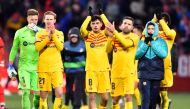 Barcelona's Spanish midfielder Pedri (centre) celebrates with teammates at the end of the Spanish League football match between Girona FC and FC Barcelona at the Montilivi stadium in Girona on January 28, 2023. (Photo by Pau BARRENA / AFP)