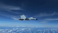 A Chinese Navy J-11 fighter jet is recorded flying close to a US Air Force RC-135 aircraft in international airspace over the South China Sea, according to the US military, in a still image from video taken December 21, 2022. (US Indo-Pacific Command/Handout via REUTERS)