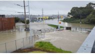An area flooded during heavy rainfall is seen in Auckland, New Zealand January 27, 2023, in this screen grab obtained from a social media video. @MonteChristoNZ/via REUTERS