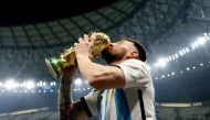 Argentina's Lionel Messi kisses the World Cup trophy as he celebrates after winning the FIFA World Cup Qatar 2022 tournament at the Lusail Stadium on December 18, 2022. (Reuters file photo)

