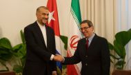Cuban Foreign Affairs Minister Bruno Rodriguez (R) and Iranian Foreign Minister Hossein Amir-Abdollahian (L) shake hands before a meeting at the Revolution Palace in Havana on February 4, 2023. (Photo by Yander ZAMORA / POOL / AFP)